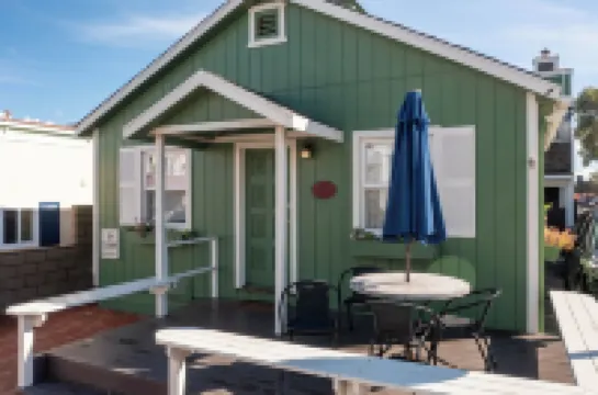 Across quiet street from sandy beach.