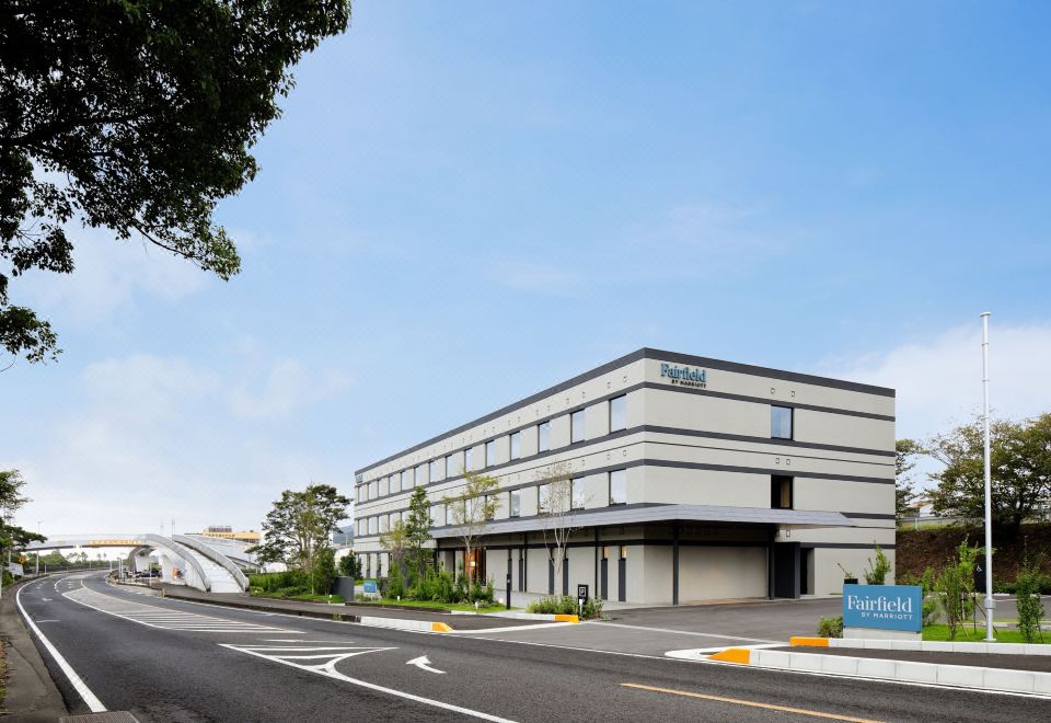 "a modern building with a white exterior and the word "" hotel "" on top , surrounded by trees and other buildings" at Fairfield by Marriott Mie Kumano Kodo Mihama