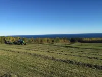 A view of Lake Superior set in the middle of a working farm