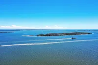 No Cleaning Fee! Brand New Double Queen Studio Condo w/ Waterfront Pool + Beach
