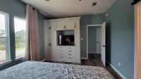 New modern home, 3 minute walk to the beach, on bike trail, full RV hookup