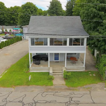 The Inn at Highland Lake, 2nd Floor, waterfront yard with a boat dock