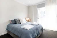 Coastal setting minutes from beach and shops