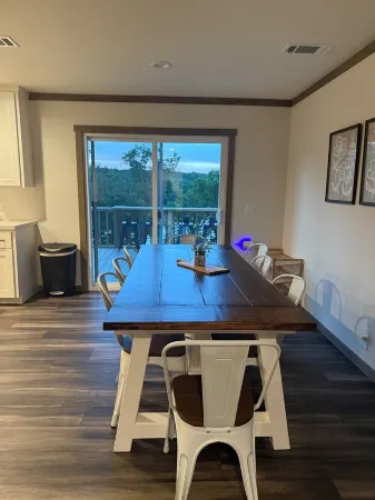 Lake front 4-bedroom house with fire pit and backyard path to the lake.