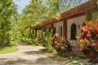 Private suite 102 with beautiful gardens, shared pool and BBQ area!