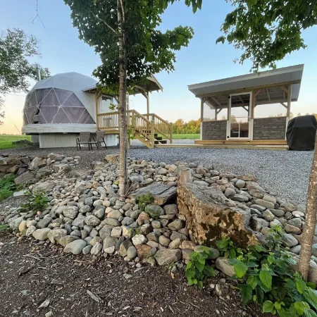 Cozy lakeside glamping dome with fireplace, AC and full bath.