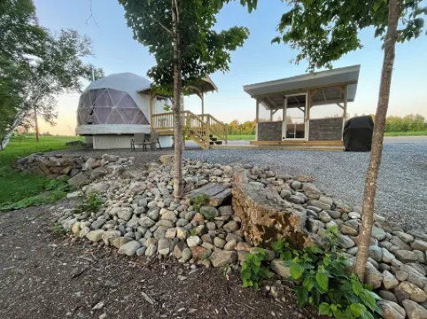 Cozy lakeside glamping dome with fireplace, AC and full bath.