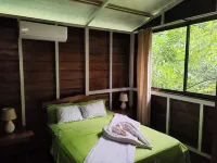 Cabin in La Fortuna with rustic finishes, river and forest
