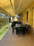 Three-room apartment with private garden 200 meters from Punta Tegge beach