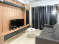 Wooden Accents 1BR at Podomoro City Deli Medan Apartment By Travelio