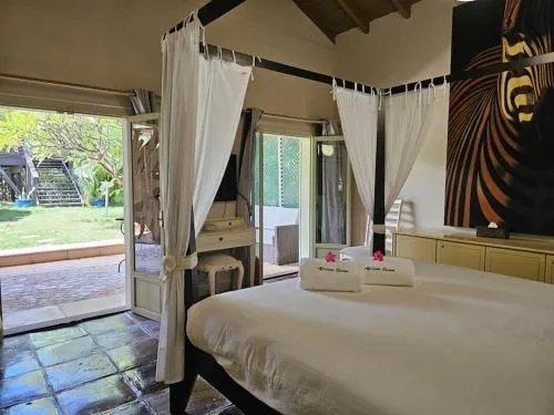 Tropical bedroom with terrace