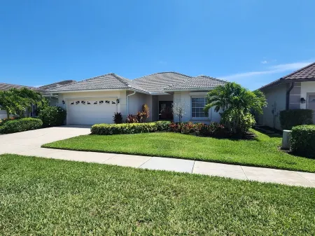 2 Bedroom + Den overlooking the Golf Course with Heated Salt Water Pool