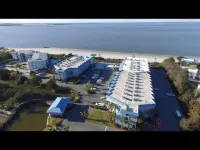 Oceanfront Condo with beautiful Sunsets - Dolphins, Pools, and family fun