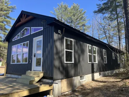 Snowmobiler & Ice Fishing Paradise right on the water with mountain views!