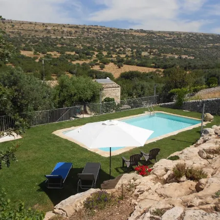 Secluded old farmhouse with a view and pool to relax in total quiet.