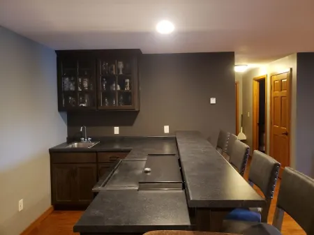 Three bedroom hide-a-way with spacious deck over looking Island Lake.