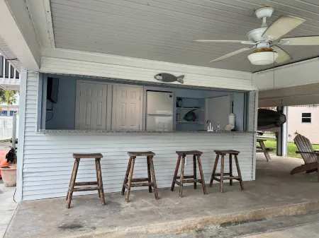 ENJOY FISHING, SWIMMING OR JUST RELAXING AT THIS JAMAICA BEACH CANAL PROPERTY