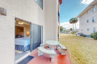 Water view studio with a patio, pool access, and central AC - snowbird friendly