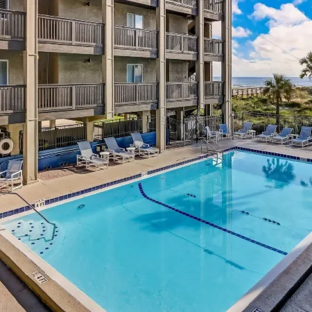 Newly Remodeled Oceanfront Condo with Salt Water Pool and Private Walkway to Beach by RedAwning