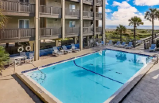 Newly Remodeled Oceanfront Condo with Salt Water Pool and Private Walkway to Beach by RedAwning