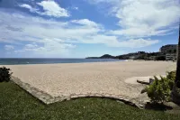 Surf and Chill: Beachfront 2-bed condo with pools, gym, steps to surf breaks