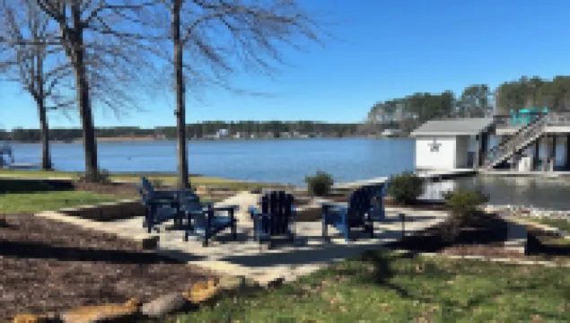 Spacious 7-bedroom, 5-bath home on 168' of a wide, deep-water cove.