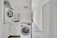 Tropical Private Oasis with heated pool just a short walk away from 4 mile beach