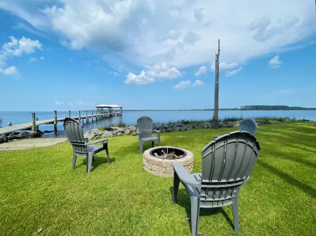 Riverfront Property with Dock and Ramp.  Dolphins, Fish, Boat, Swim & More