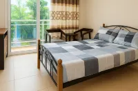 Cozy Guest Room in Kinshasa with Balcony and Partial Air-Conditioning
