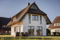 Dream thatched house with water view - 3 bedrooms - 10 min. walk to the beach - 4-Star