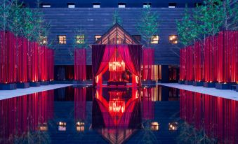 At night, there is a red and white building with floor lights, as well as other features at the Westin Xi'an