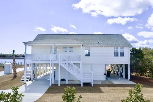 Enjoy a 3-bedroom waterfront vacation home just 10 minutes from Emerald Isle Hotels in Cedar Point