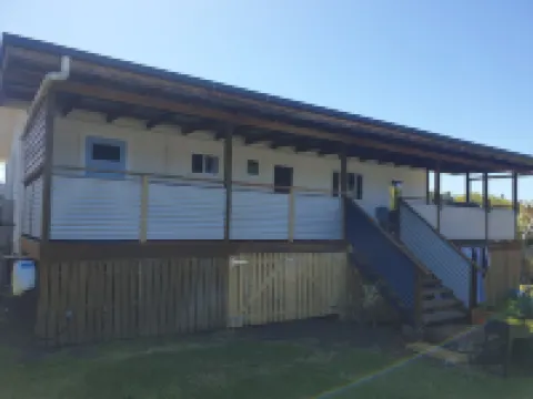 Indoor/outdoor pet-friendly beach house next to world-class beach and river.