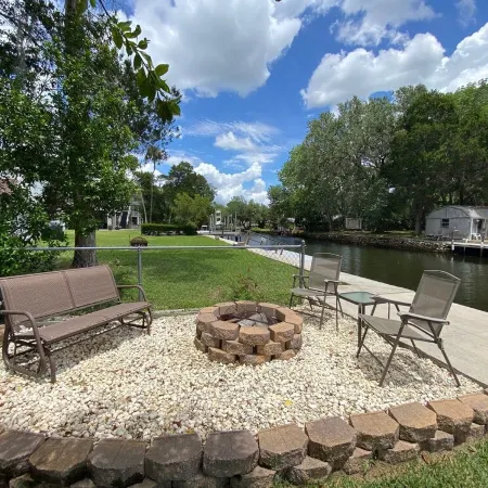 Waterfront Paradise w dock, large patio, lanai, pool, hot tub! Bring your boat!