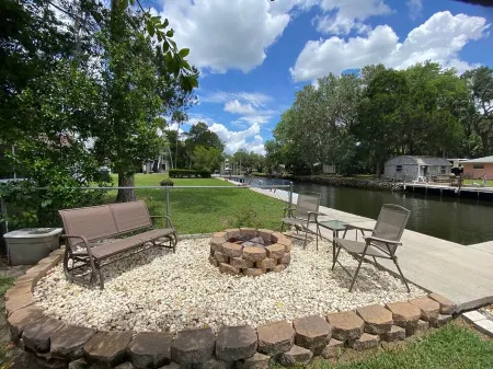 Waterfront Paradise w dock, large patio, lanai, pool, hot tub! Bring your boat!