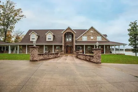 "LAKE HOUSE" On 7 Acres Of Douglas Lake With A Private Boat Ramp & Private Dock!