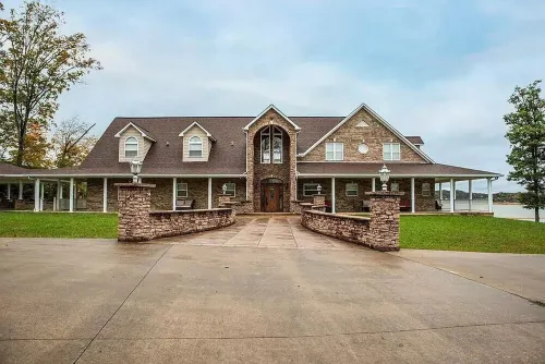 "LAKE HOUSE" On 7 Acres Of Douglas Lake With A Private Boat Ramp & Private Dock!