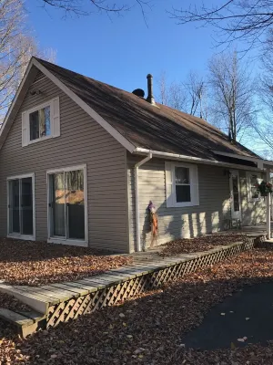 Cozy vacation home nestled in a quiet wooded area. Near town but private
