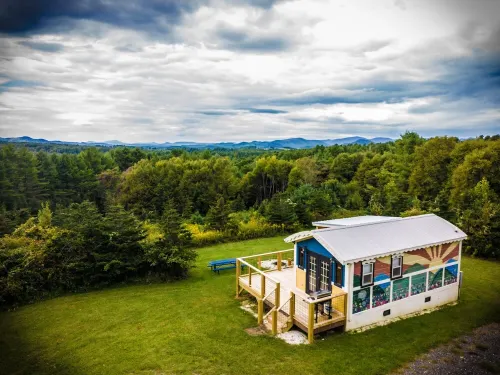 Tiny, charming mountaintop cottage with large firepit, deck and amazing views