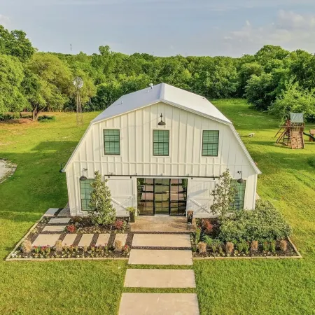 HGTV’s “BARNDOMINIUM” 16 Acres w/ Lake, Outdoor Kitchen, Decks & Playground