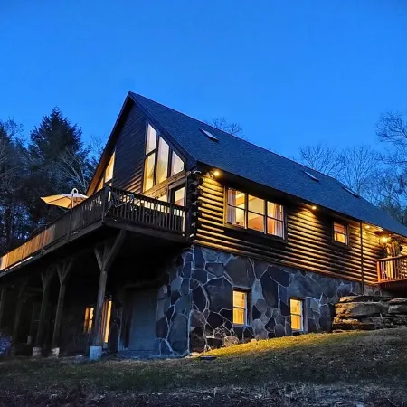 Secluded modern log cabin with picturesque private water fall on 12 acres!