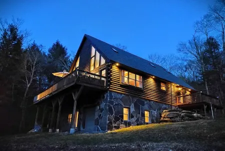 Secluded modern log cabin with picturesque private water fall on 12 acres!