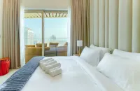 Elite LUX Holiday Homes - Beachfront 1BR Oasis & Stunning Views By Elie Saab Отели в г. 