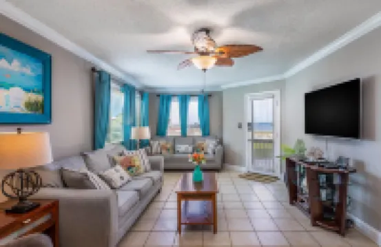 Sound-view beach condo with private balcony, pool, grills, central AC, & W/D