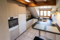 Beautiful penthouse duplex apartment with balcony surrounded by greenery