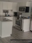 Beautiful ground floor remodeled condo steps to the beach