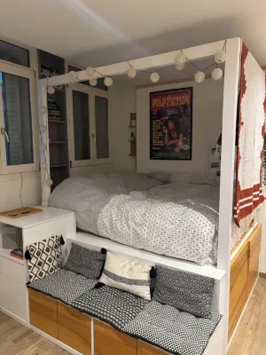 Charming little studio with lake and mountain views from the bed.