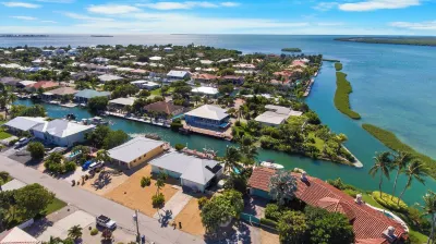 Waterfront Home with a Large Dock, Pool, and Deck Area. Can Accommodate Pets. Hotels near Capt. Pete's Coconut Garden