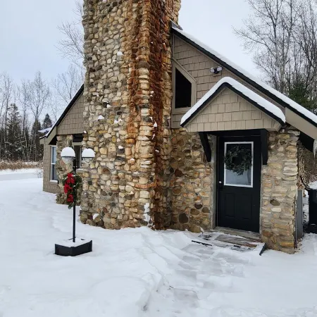 Escape to "The Woods": A Secluded Stone Cabin Retreat.