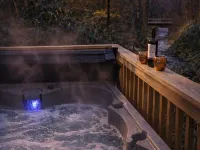 Steps to Elk River! Cozy Cabin w/ Hot Tub & Bunk Room Hotels in Avery County